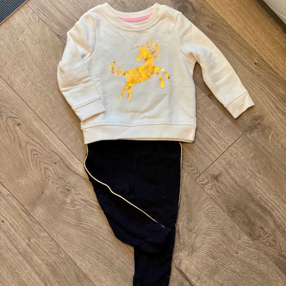soft unicorn sweatshirt & black pants w gold trim